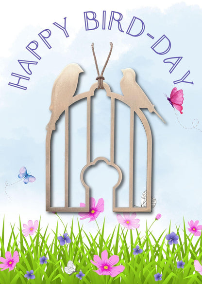 a happy birthday card with two birds in a cage