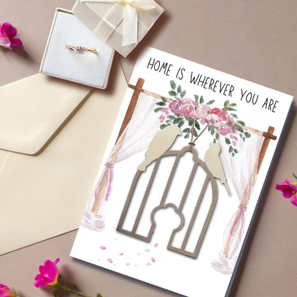 a card with a picture of a bird in a cage