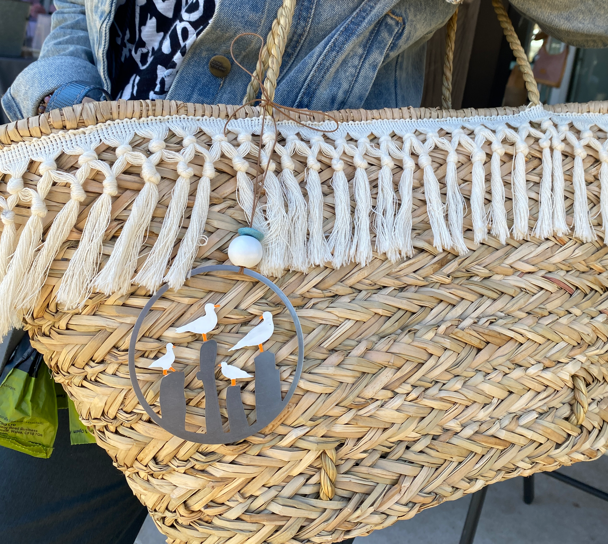 a person is holding a woven basket