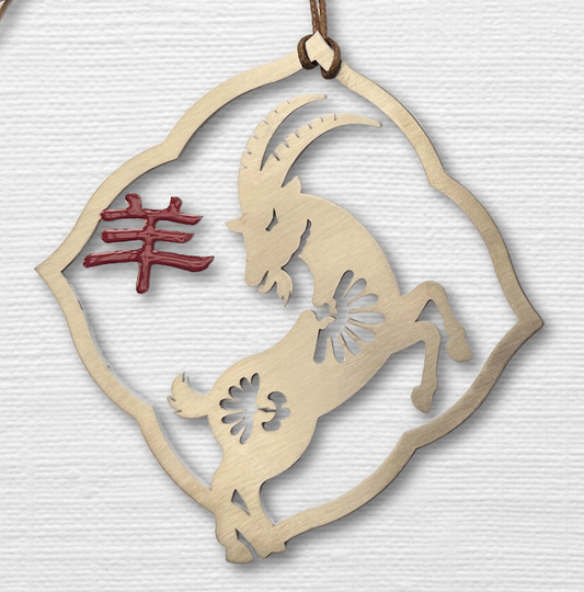 a wooden ornament with a goat on it