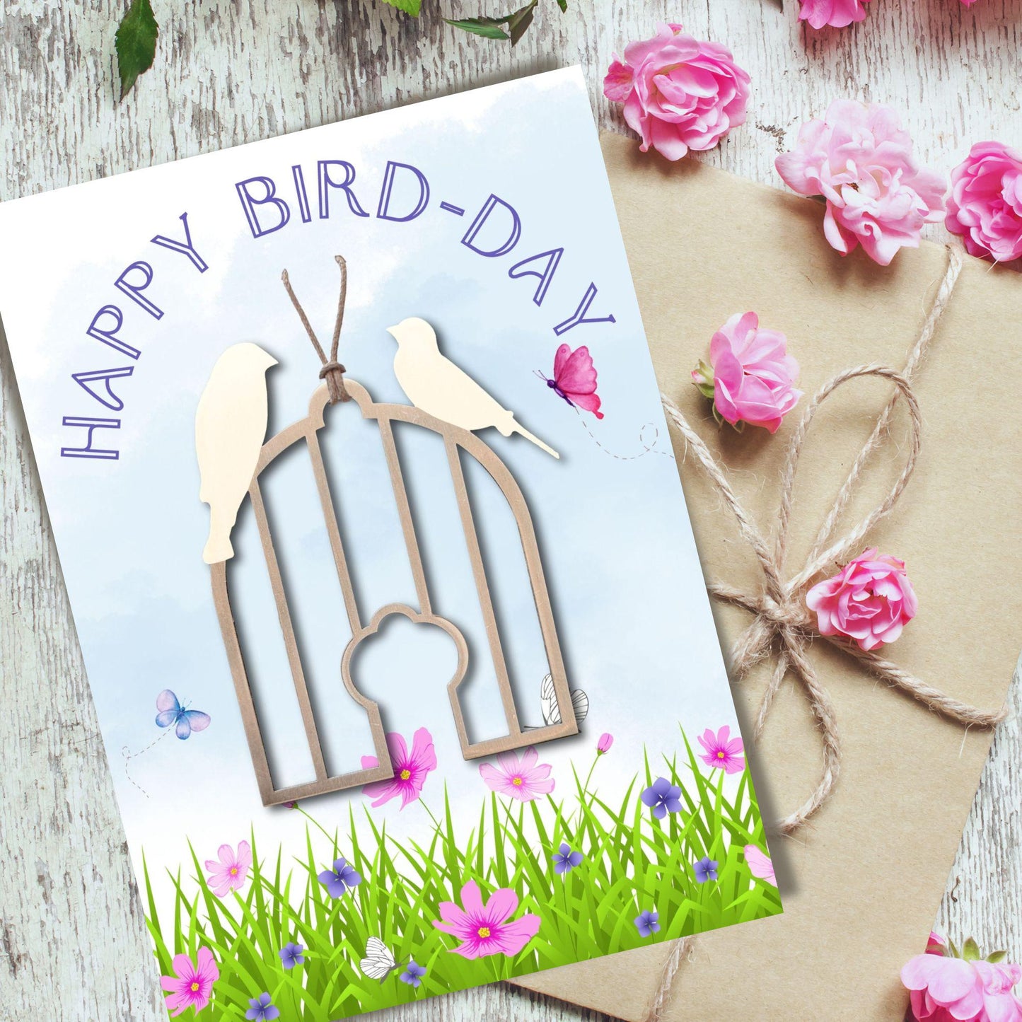 a card with a bird and a birdcage on it