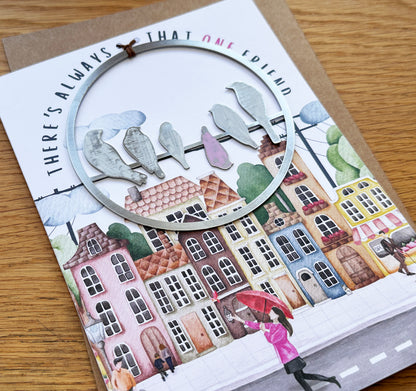 a card with a picture of a woman holding an umbrella