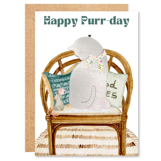 a card with a dog sitting on a chair