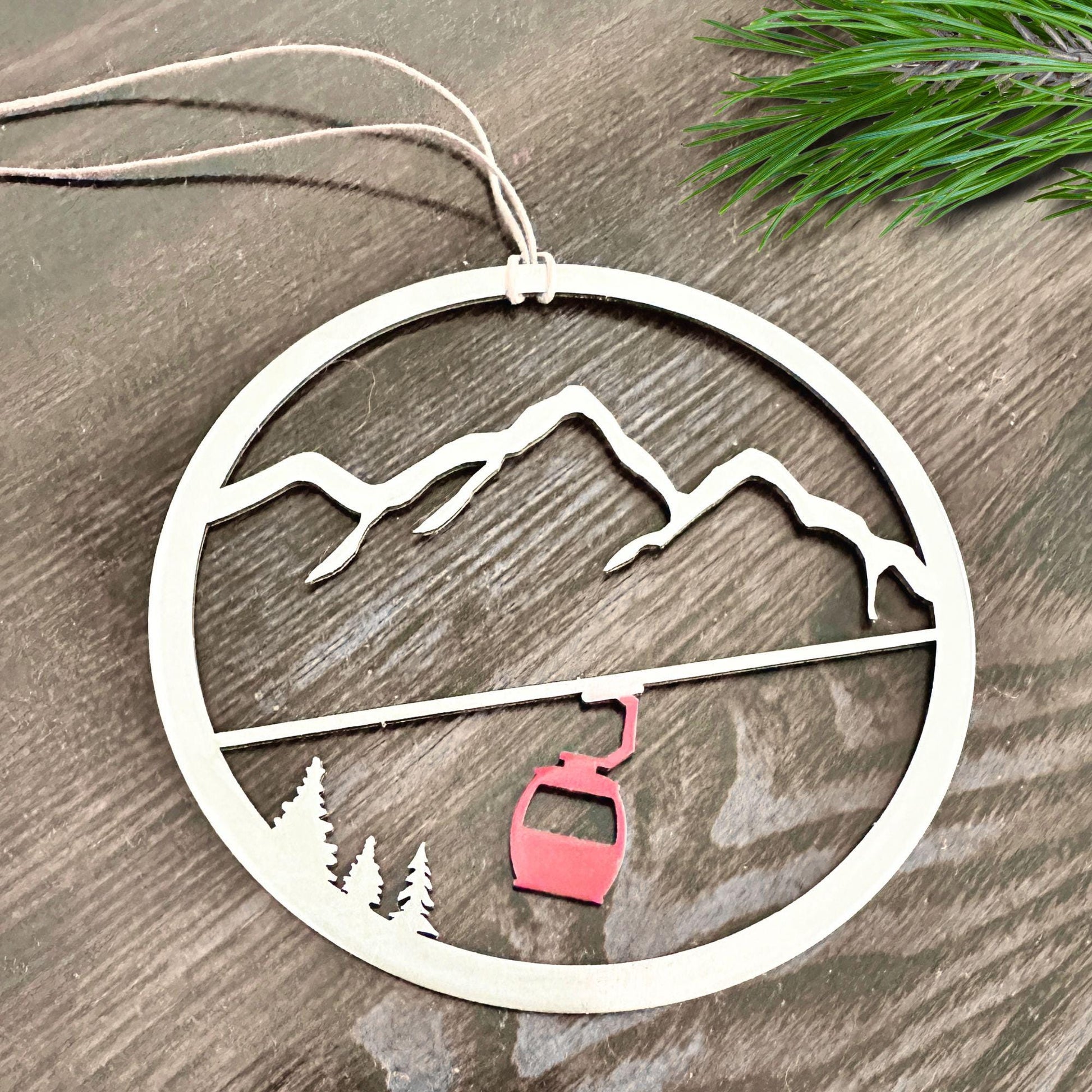 a metal ornament with a ski lift on it